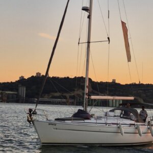 River cruising on the Tagus River during sunset in Lisbon.