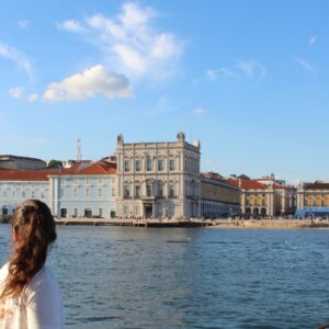 View of Lisbon’s historic waterfront and Praça do Comércio seen from the Tagus River.