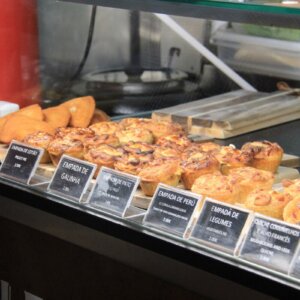 Selection of traditional Portuguese savoury pastries and snacks displayed in a local bakery