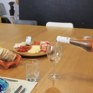 Portuguese wine being served alongside traditional cheeses, charcuterie and local products.