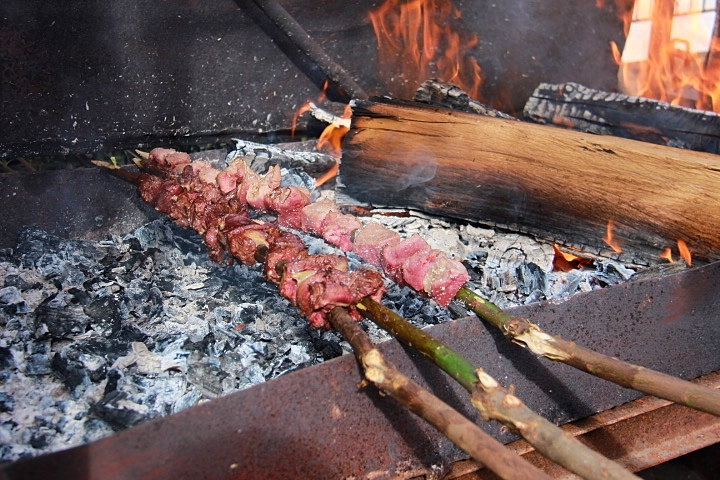 Espetada skewered on a laurel branch in Madeira Island