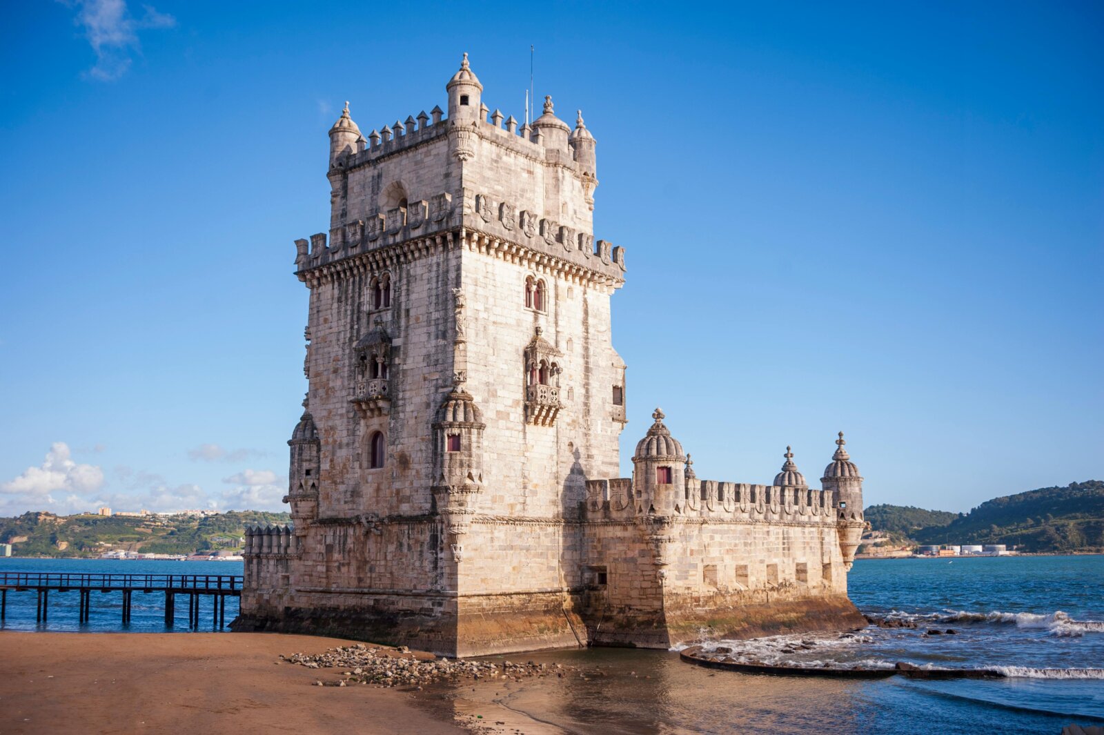 Belem Tower on the banks of the Tagus River in Lisbon, Portugal — a UNESCO World Heritage Site and iconic example of Manueline architecture, featured in cultural and historical tours. 